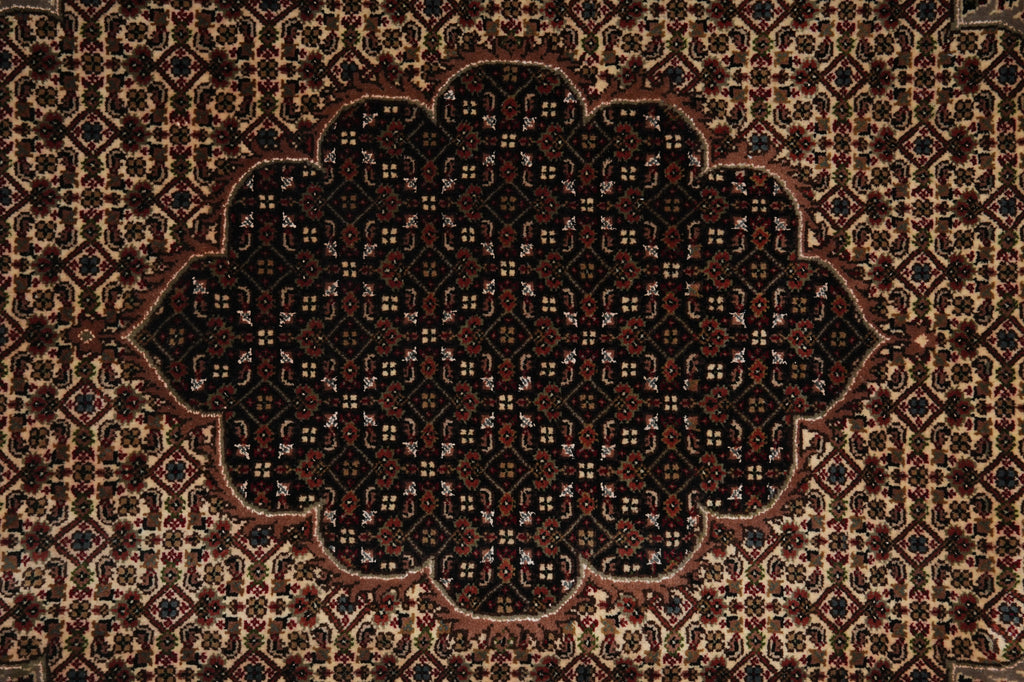 Close-up of a patterned rug with intricate designs.