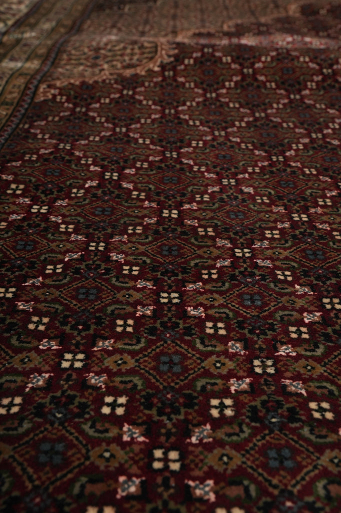 Close-up of a patterned rug with intricate designs.