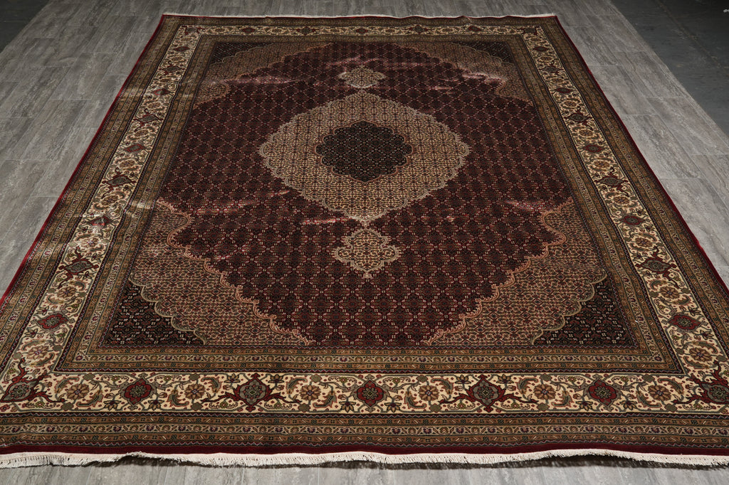 Decorative rug with intricate patterns on a wooden floor