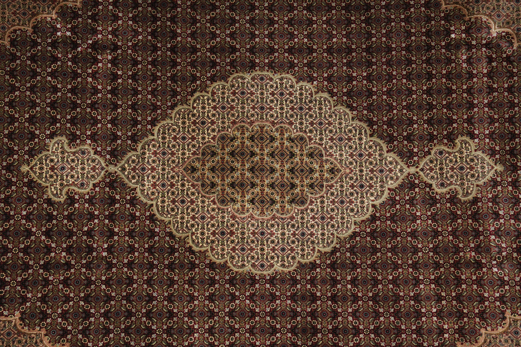 Close-up of a patterned rug with intricate designs.
