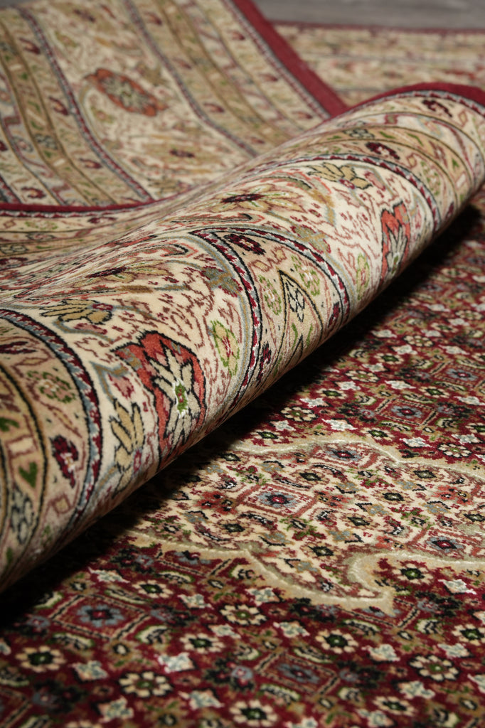 Close-up of a patterned rug with intricate designs.