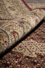 Load image into Gallery viewer, Close-up of a patterned rug with intricate designs.