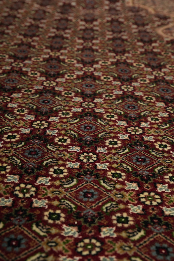 Close-up of a patterned rug with intricate designs.