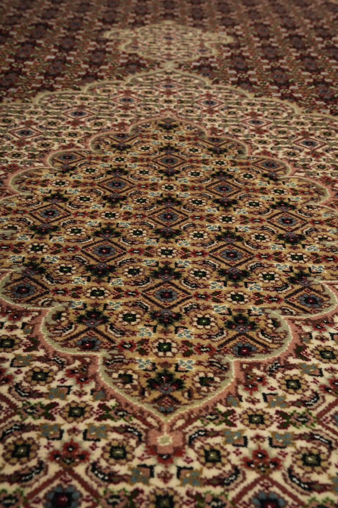 Close-up of a patterned rug with intricate designs.