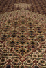 Load image into Gallery viewer, Close-up of a patterned rug with intricate designs.