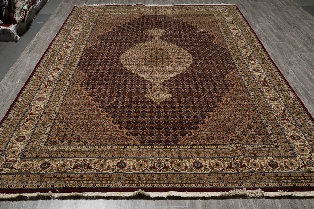 Decorative rug with intricate patterns on a wooden floor
