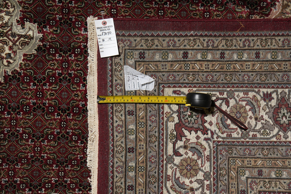 Patterned rug with a measuring tape and a small object on top