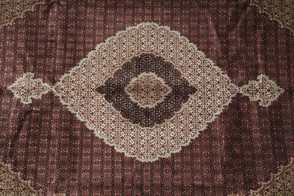 Close-up of a patterned rug with a central medallion design.