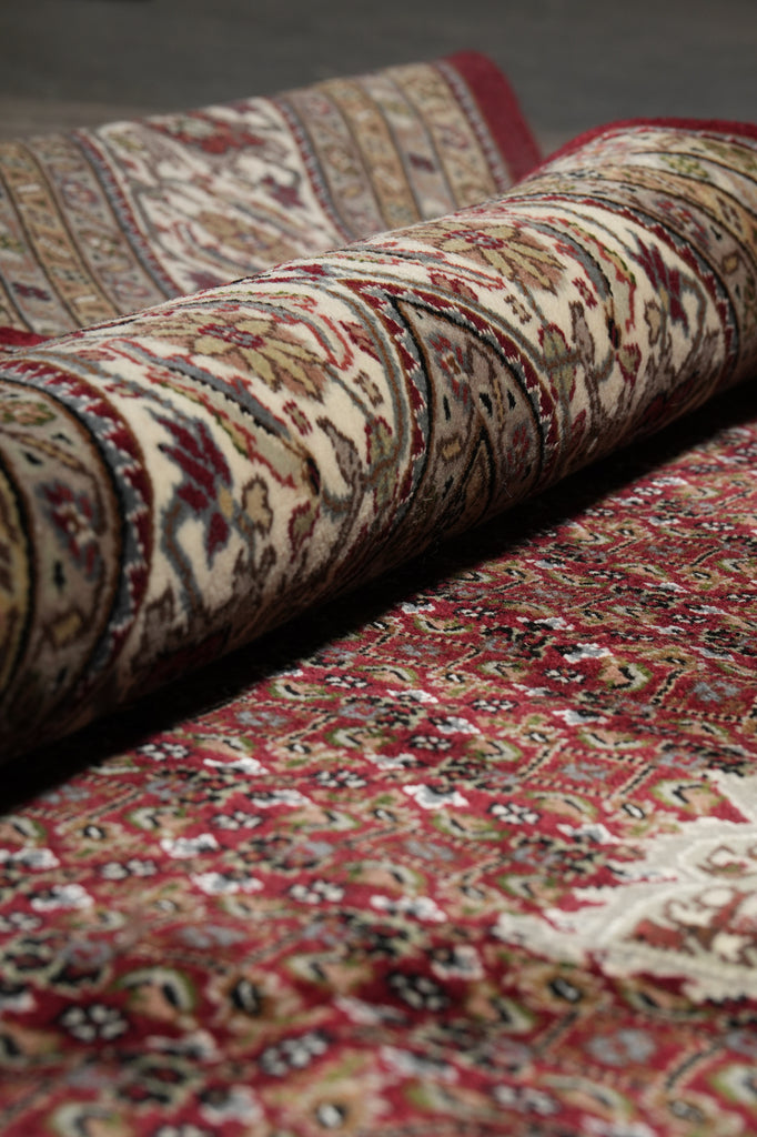 Close-up of patterned rugs with a focus on texture and design.
