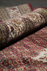 Load image into Gallery viewer, Close-up of patterned rugs with a focus on texture and design.