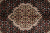 Load image into Gallery viewer, Close-up of a patterned rug with intricate designs.