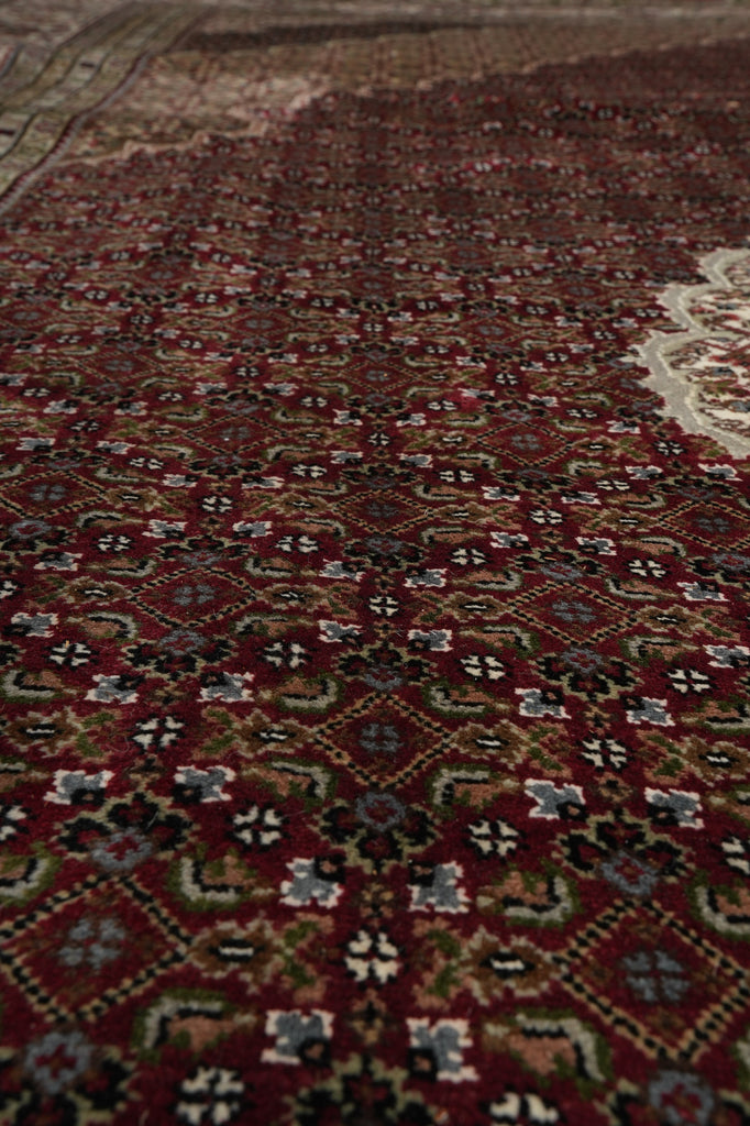 Close-up of a patterned rug with intricate designs.