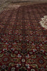 Load image into Gallery viewer, Close-up of a patterned rug with intricate designs.
