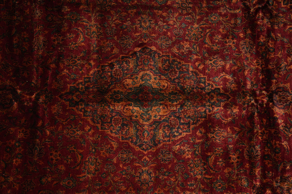 Close-up of a red patterned fabric with intricate designs
