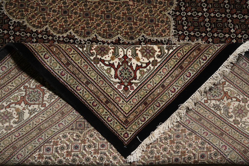 Close-up of a patterned rug with intricate designs.