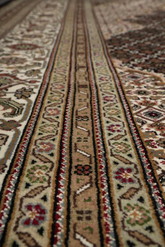 Close-up of a patterned rug with intricate designs.