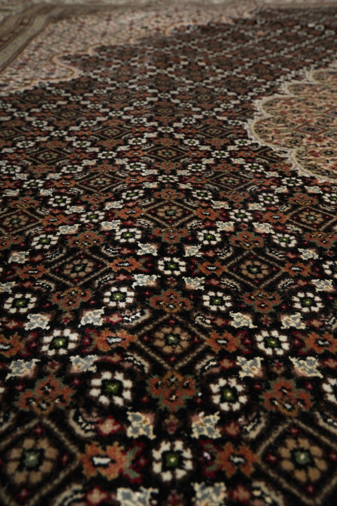 Close-up of a patterned rug with intricate designs.