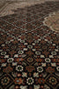 Load image into Gallery viewer, Close-up of a patterned rug with intricate designs.