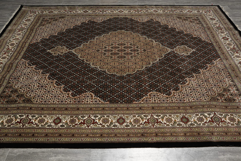 Decorative rug with intricate patterns on a wooden floor