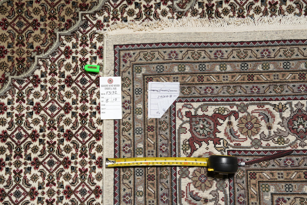 Patterned rug with a measuring tape and size tag on it