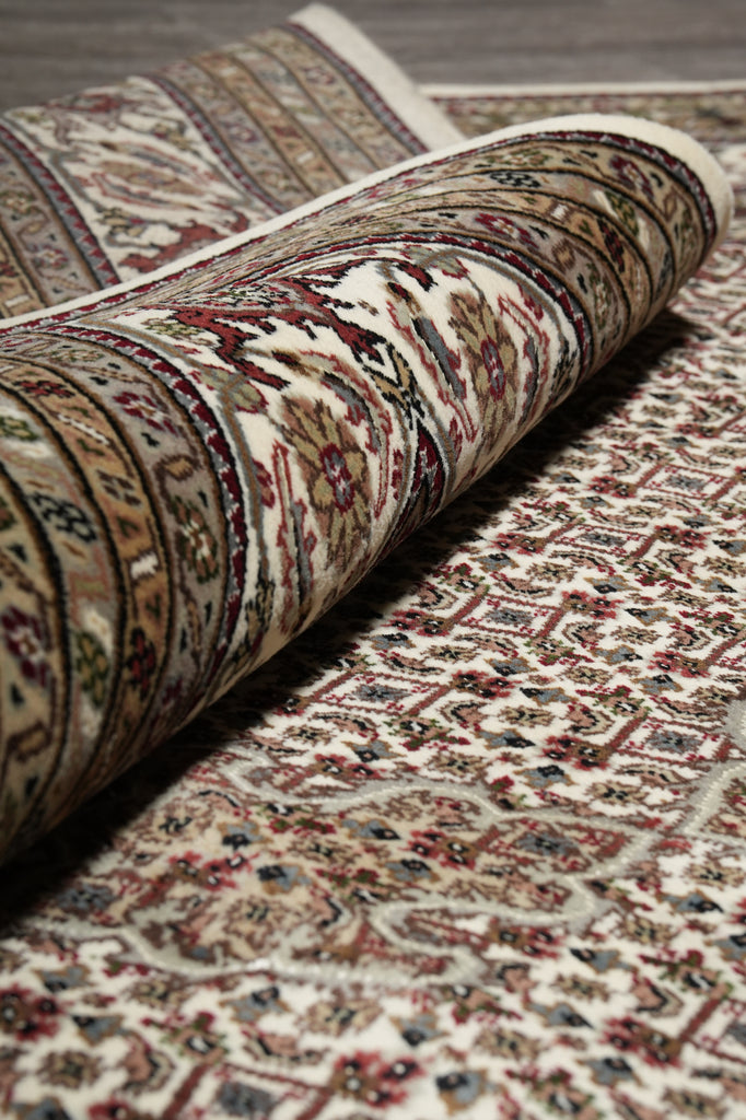 Close-up of a patterned rug with intricate designs.