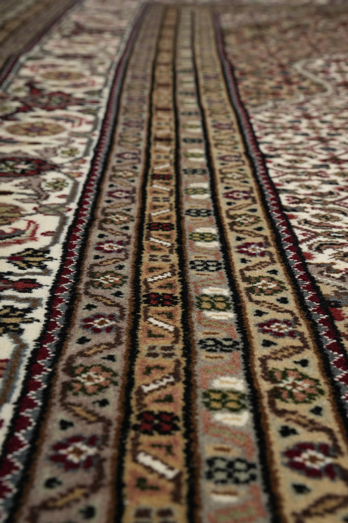 Close-up of a patterned rug with intricate designs.