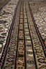 Load image into Gallery viewer, Close-up of a patterned rug with intricate designs.