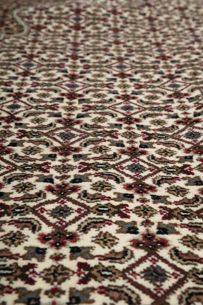 Close-up of a patterned rug with intricate designs.