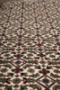 Load image into Gallery viewer, Close-up of a patterned rug with intricate designs.