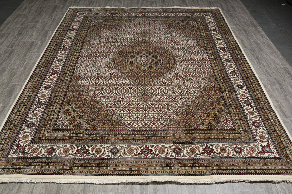 Decorative rug with intricate patterns on a wooden floor