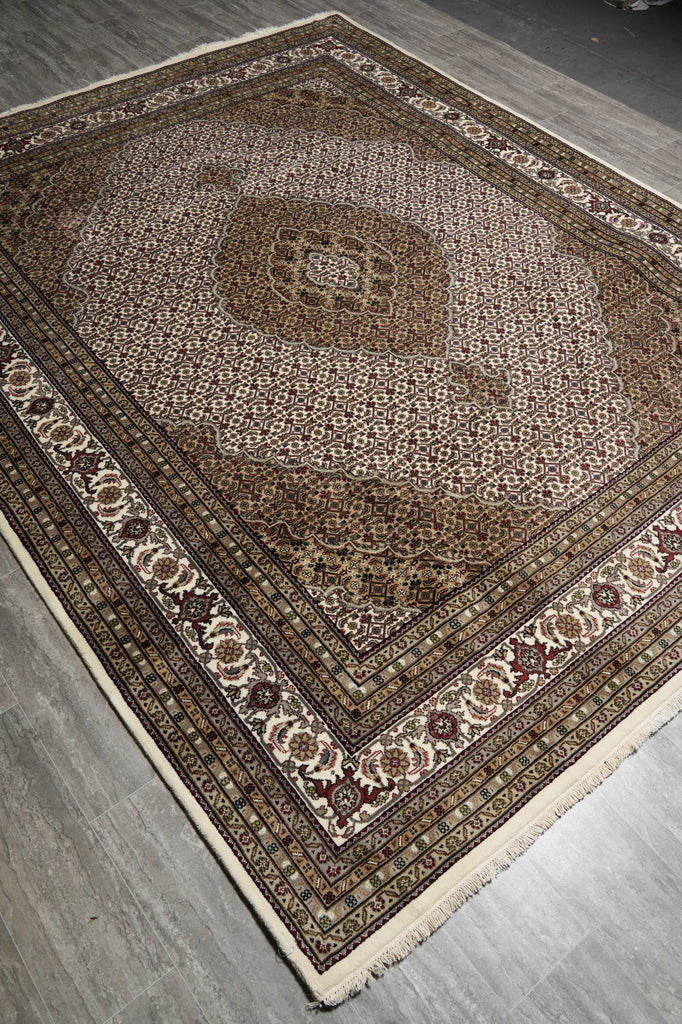 Decorative rug with intricate patterns on a wooden floor