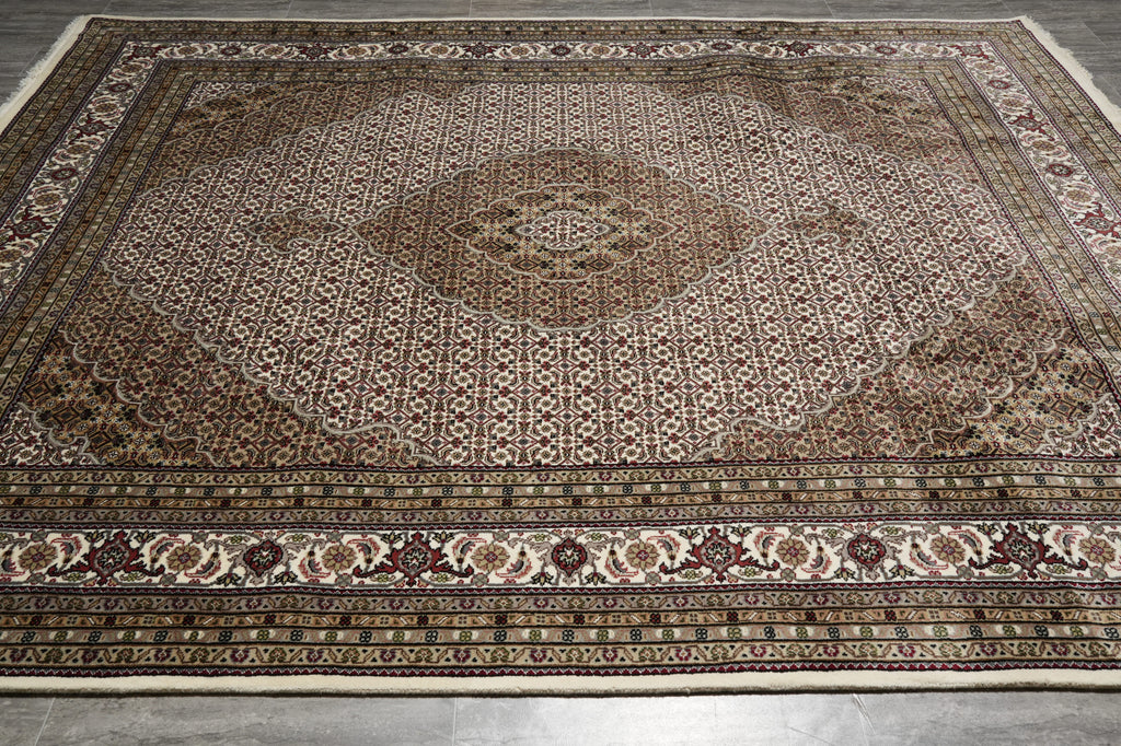 Decorative rug with intricate patterns on a plain background