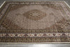 Load image into Gallery viewer, Decorative rug with intricate patterns on a plain background