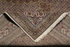 Load image into Gallery viewer, Close-up of a patterned rug with intricate designs and fringes.