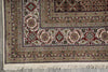 Load image into Gallery viewer, Close-up of a patterned rug with intricate designs on a concrete floor.