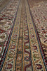 Load image into Gallery viewer, Close-up of a patterned rug with intricate designs.