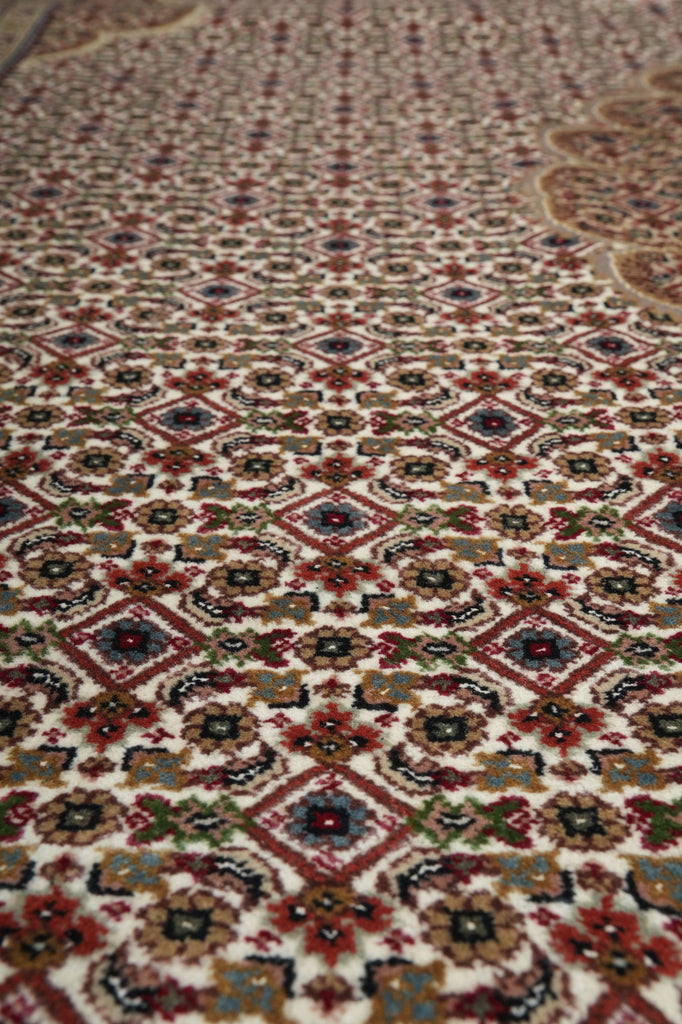 Close-up of a patterned rug with intricate designs.
