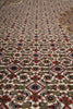 Load image into Gallery viewer, Close-up of a patterned rug with intricate designs.