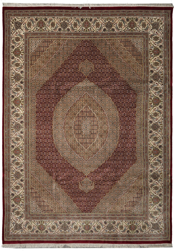 Decorative rug with intricate patterns and a central medallion on a plain background