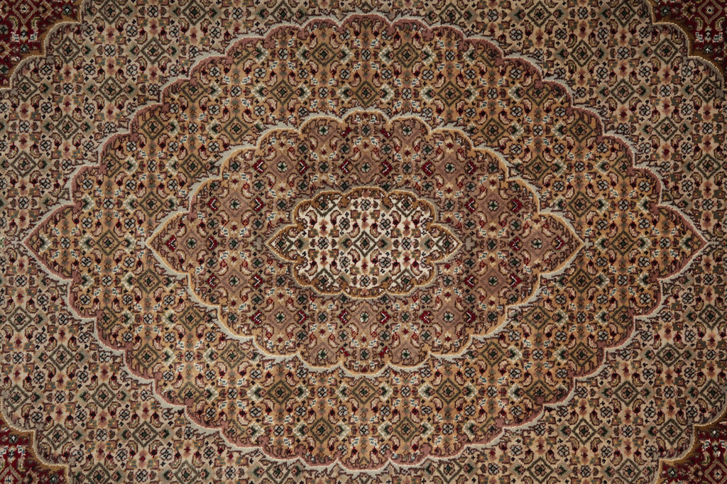 Close-up of a patterned rug with intricate designs.