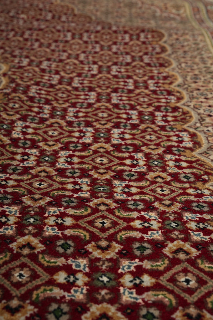 Close-up of a patterned rug with intricate designs.