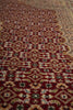 Load image into Gallery viewer, Close-up of a patterned rug with intricate designs.