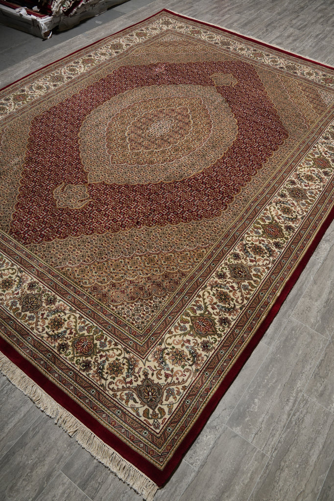 Decorative rug with intricate patterns on a wooden floor