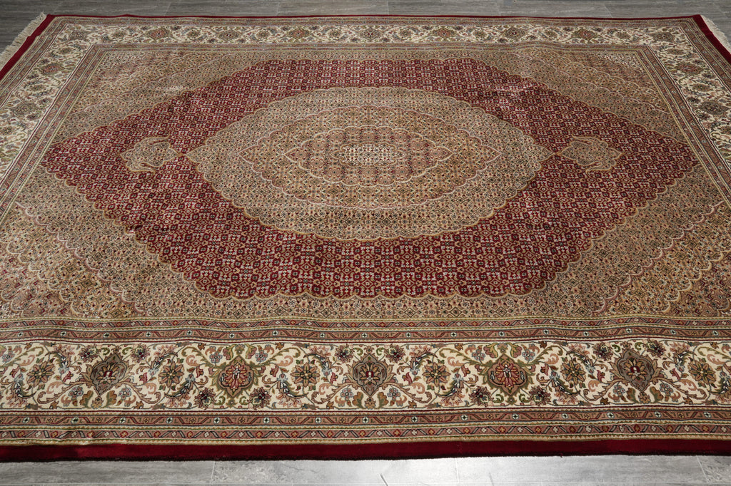 Decorative rug with intricate patterns on a wooden floor