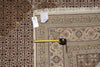 Load image into Gallery viewer, Patterned rug with a measuring tape and size tag.