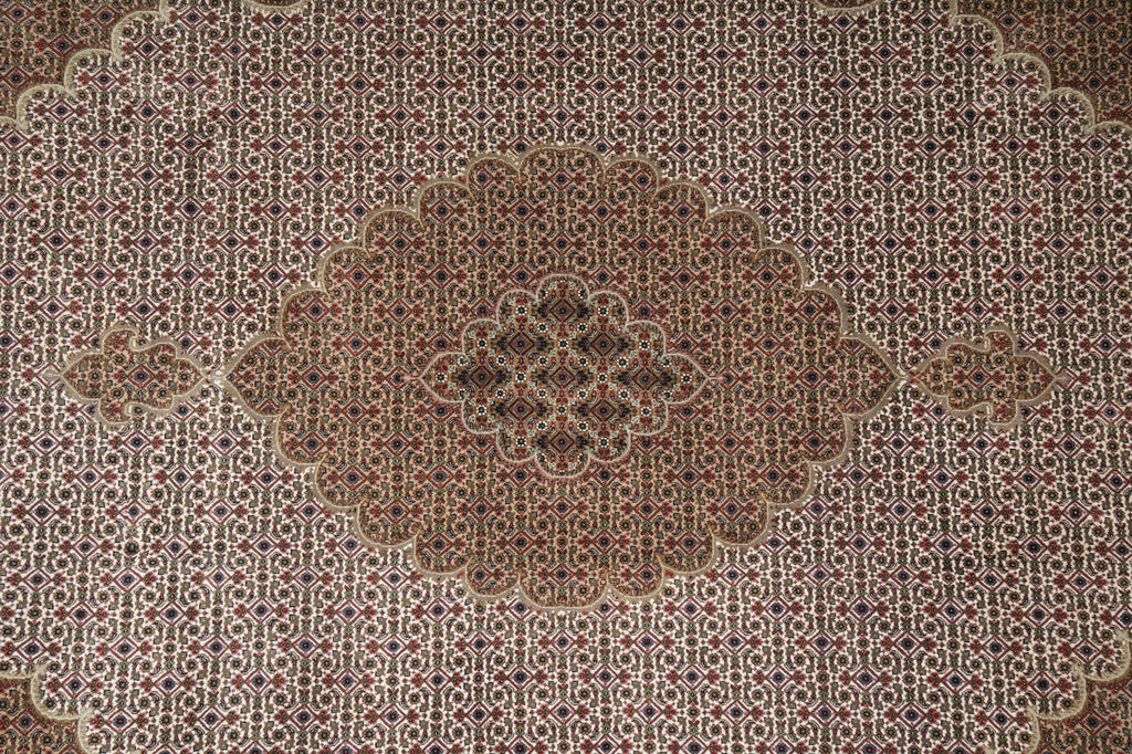 Close-up of a patterned rug with intricate designs.