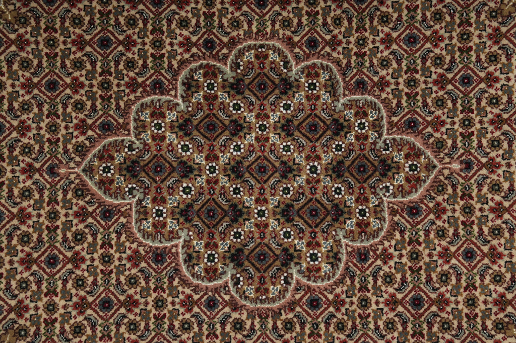 Close-up of a patterned rug with intricate designs.