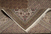 Load image into Gallery viewer, Close-up of a patterned rug with intricate designs and fringes.