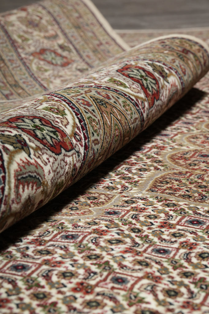 Close-up of a patterned rug with intricate designs.