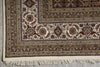Load image into Gallery viewer, Close-up of a patterned rug with intricate designs on a neutral background